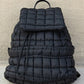 Black Solid Flapped Quilted Puffer Backpack